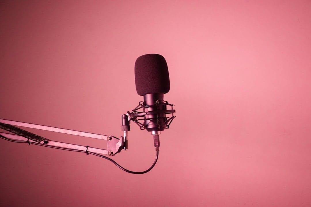 Person speaking into microphone representing the power of your own voice